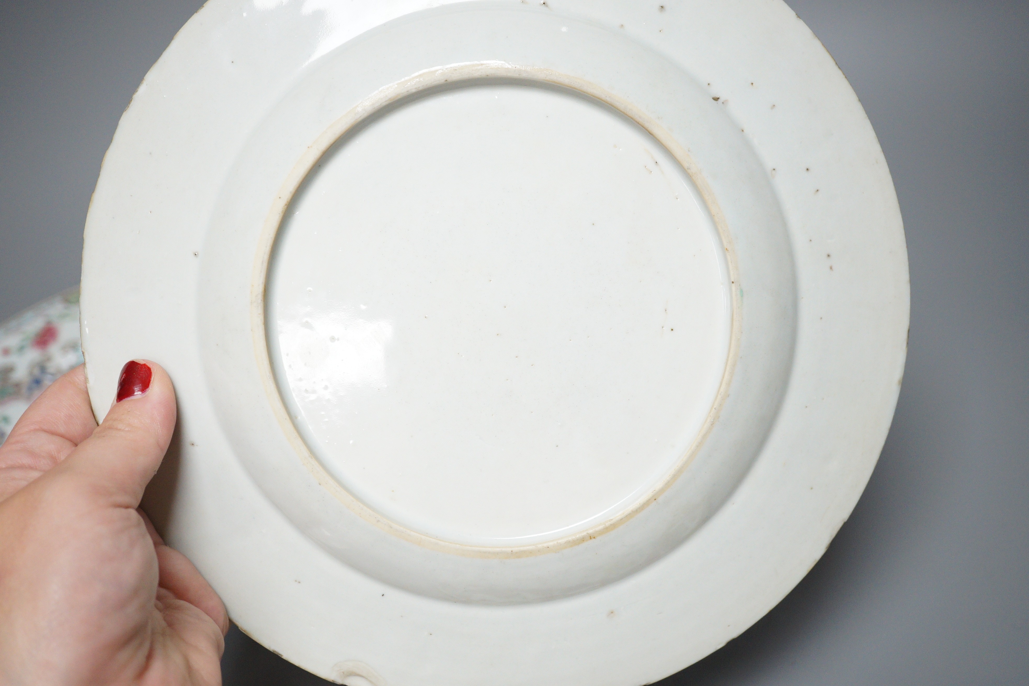 A pair of 18th century Chinese export famille rose plates and two others, largest 23cm